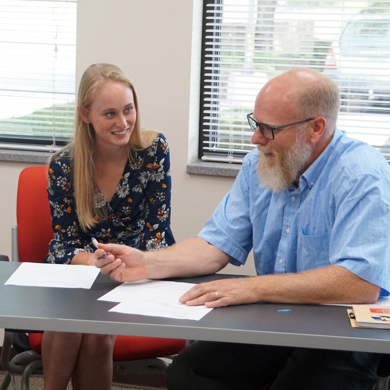 Geo-Launchpad intern speaking with faculty mentor