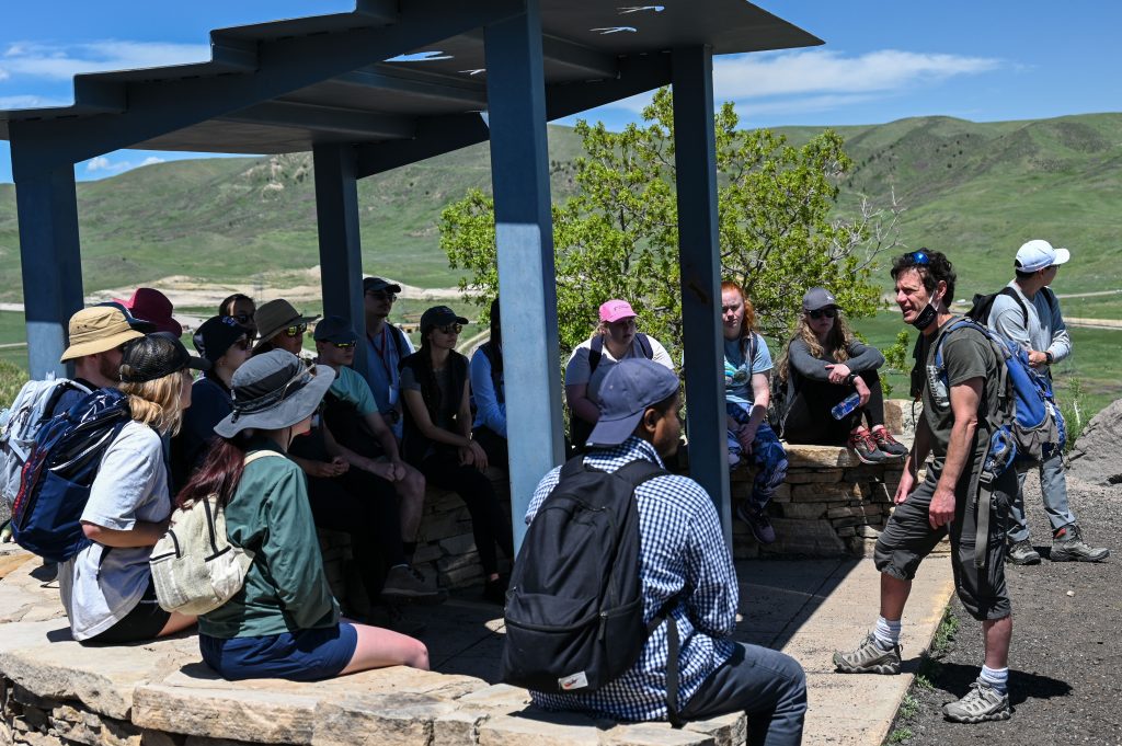 group listening to field trip leader