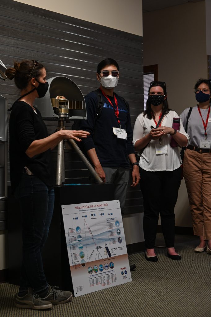 interns listening to description of gps display instrument