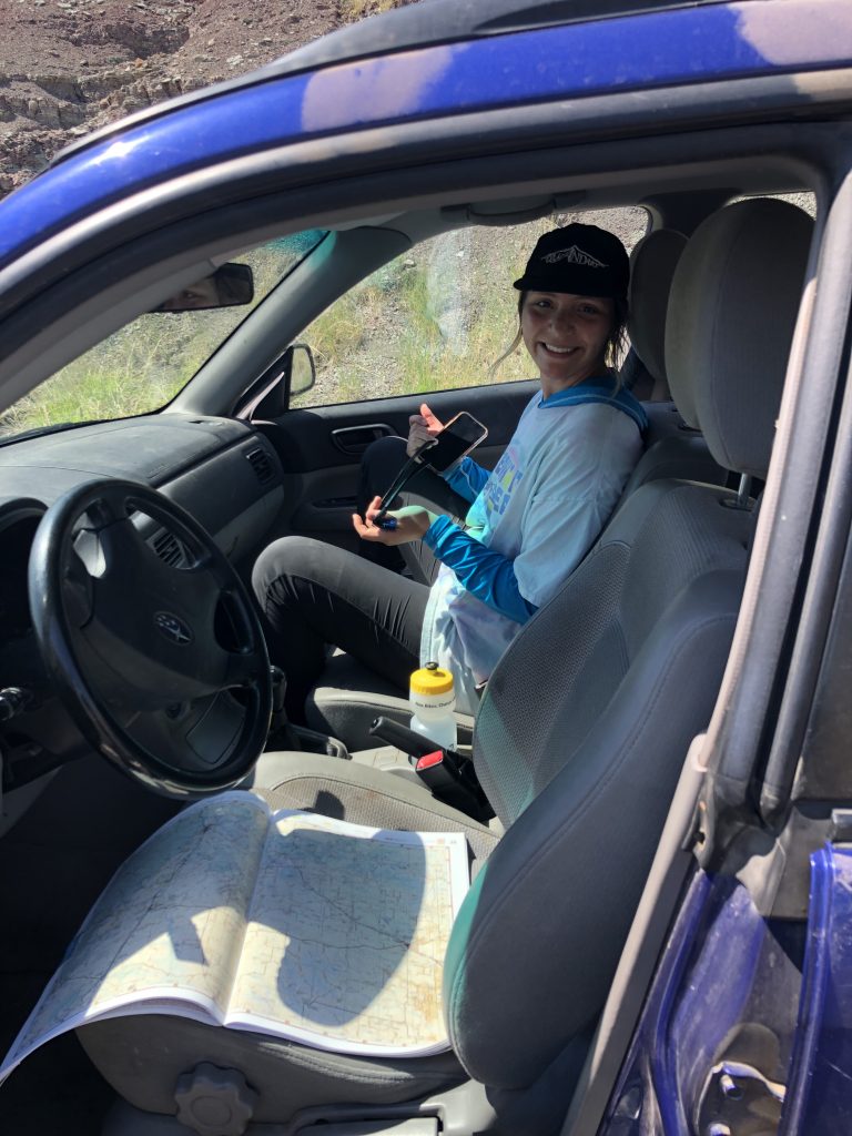 Skye Fernandez (RESESS) sitting in the passenger seat of a car on the rock sampling trip.