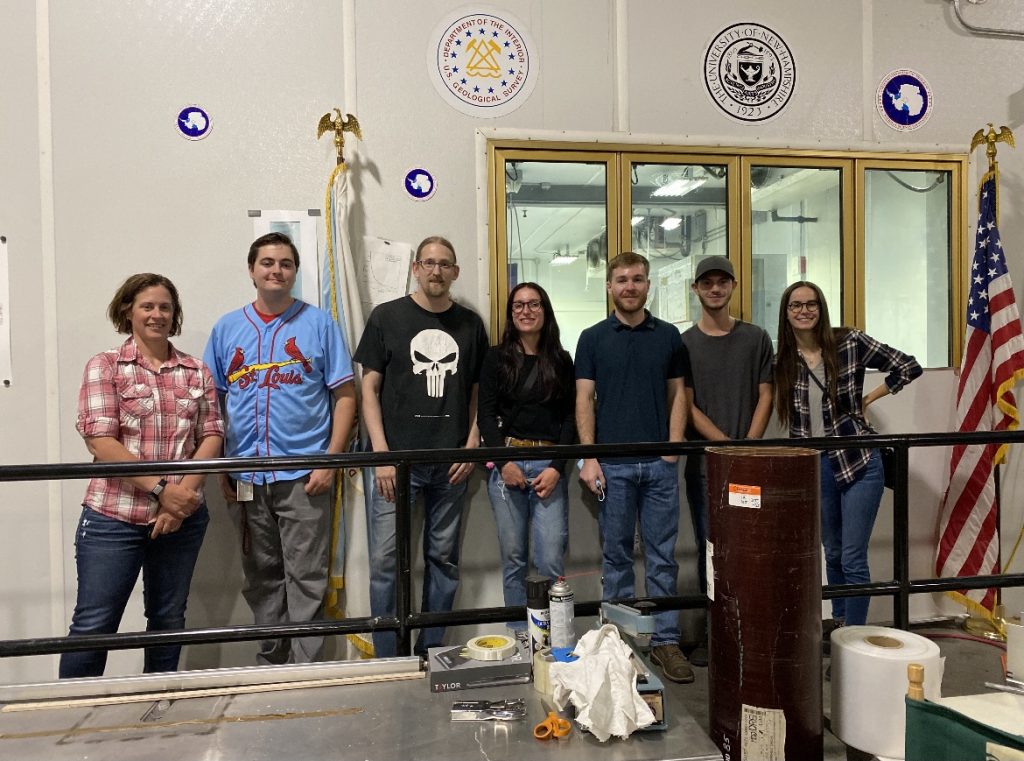 Mentor Mikki Johnson, two NSF Ice Core Facility employees, and the Geo-Launchpad Interns (Madalyn Massey, Patrick Walston, Jimmy Swift, and Allison Sowers) smiling for a picture before leaving the NSF Ice Core Facility.