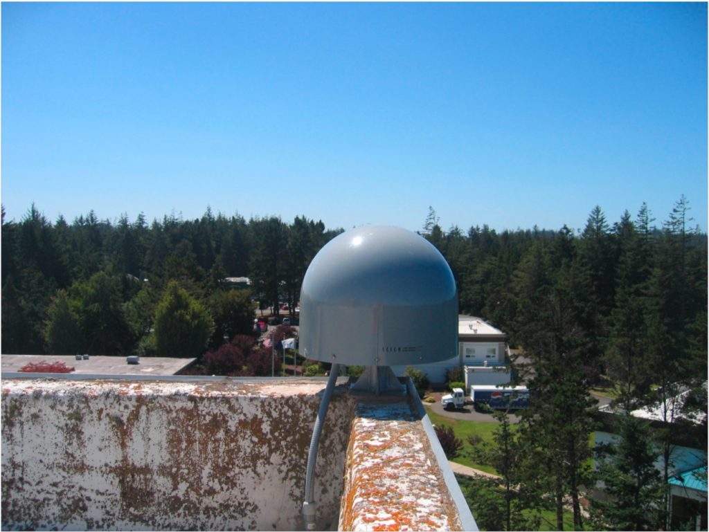 GPS antenna mounted to the corner of a roof