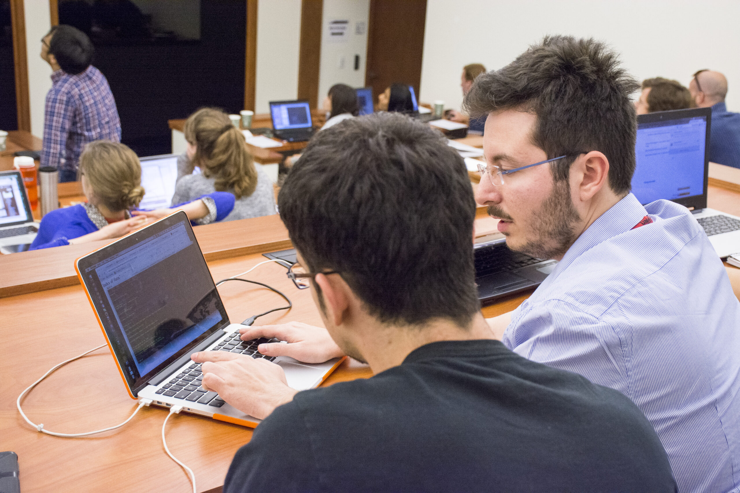 short course participants working on laptops