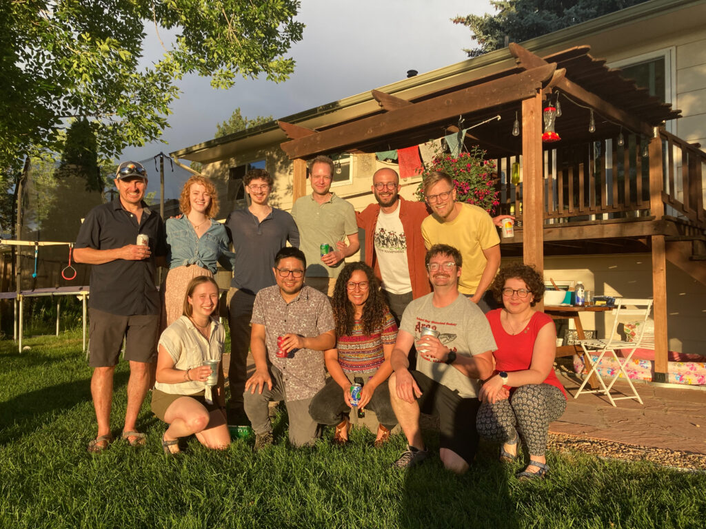 The Organic Geochemistry Lab group From University of Colorado Boulder smiling for a group photo at their backyard potluck.