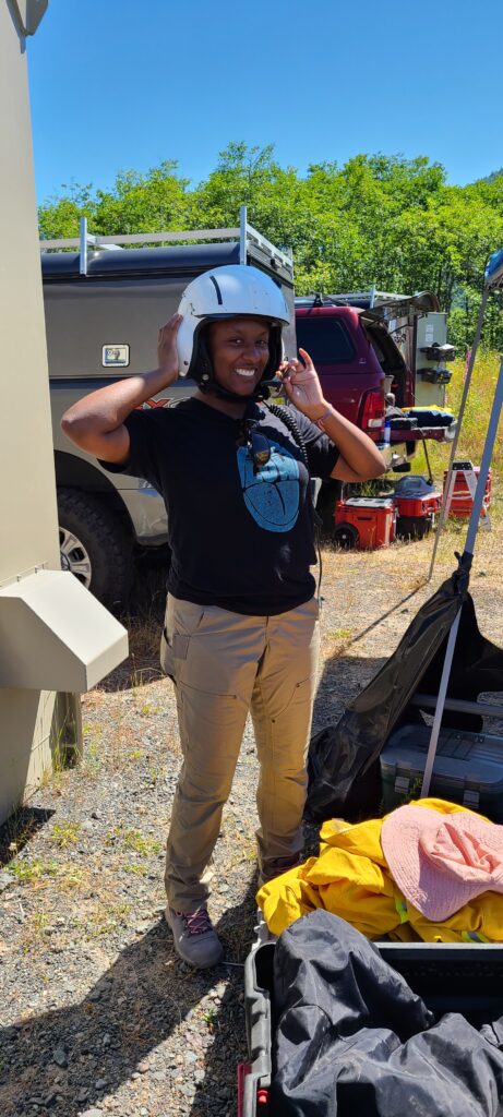 USIP Intern Kayla Byrd smiling with a helmet on.