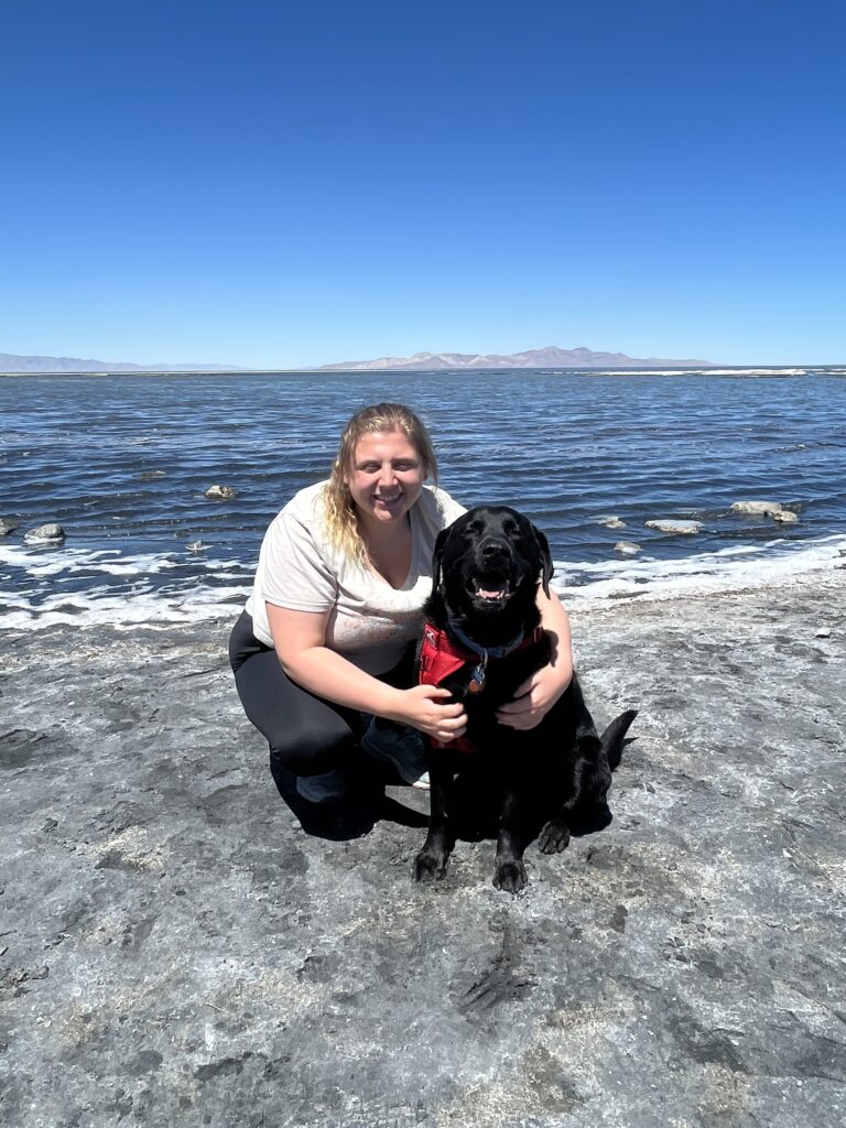 Lucia and her black lab, Duff, at the Great Salt Lake