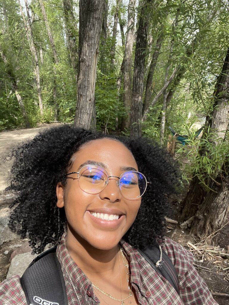 Selfie of RESESS Intern Keneni Godana in a forest.