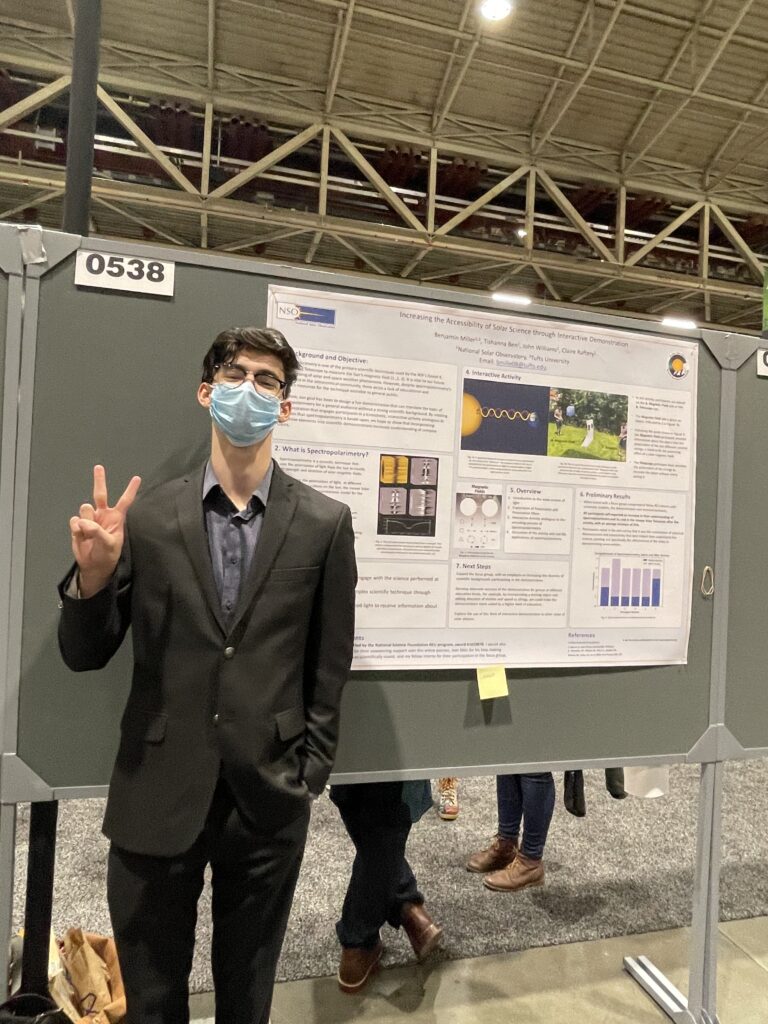 RESESS Intern Ben Miller makes a peace sign while standing next to his poster at the American Geophysical Union 2021 Annual Conference in New Orleans, LA.